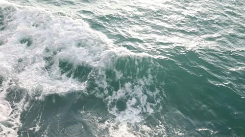 Slow motion drone video of aerial view of and ocean with waves Stock Footage 343825398