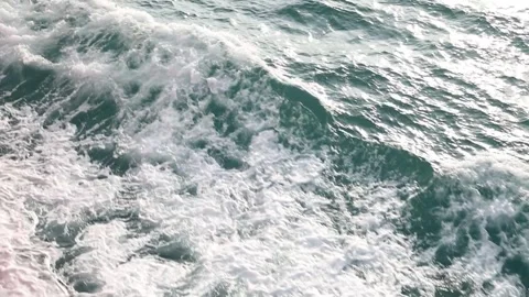 Slow motion drone video of aerial view of and ocean with waves Stock Footage 343825407