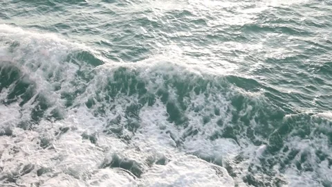 Slow motion drone video of aerial view of and ocean with waves Stock Footage 343825420