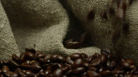 Slow-motion drop of coffee into burlap bag Stock Footage 142072019