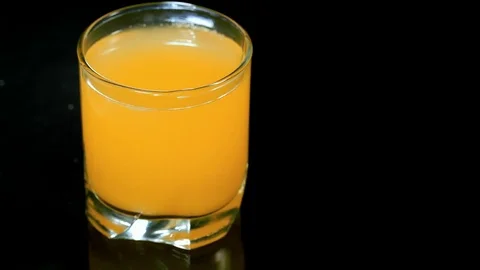 Slow motion drop falling in the cocktail Stock Footage 73622956