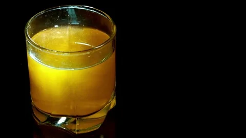 Slow motion drop falling in the cocktail Video stock 73623105