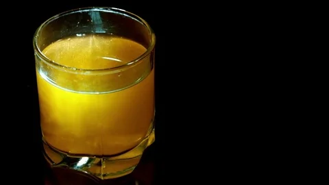 Slow motion drop falling in the cocktail Stock Footage 73623182