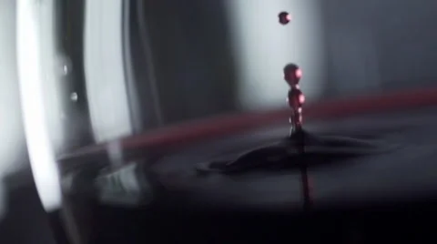 Slow motion drop of red wine close-up Video stock 41382797