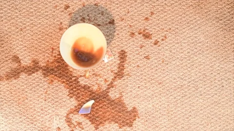 Slow motion dropped cup of coffee falling onto carpet Stock Footage 237220661