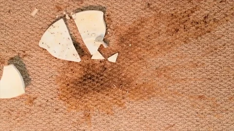 Slow motion dropped cup of coffee falling onto carpet Stock Footage 237221162