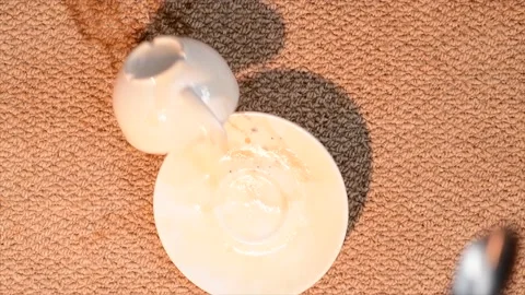 Slow motion dropped cup of coffee falling onto carpet Stock Footage 237221166