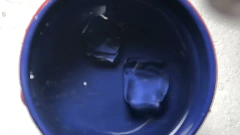 Slow motion of dropping icecube into water and splashing Vídeo Stock 93009044