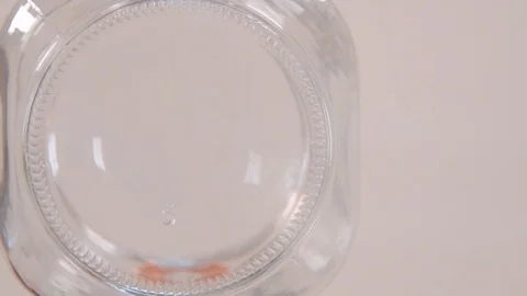Slow Motion Dropping Pennies into Jar Copy Space Stock Footage 123809315