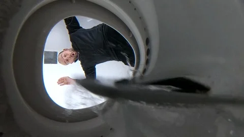 Slow motion dropping smart phone into toilet - clumsy man Stock Footage 100126963