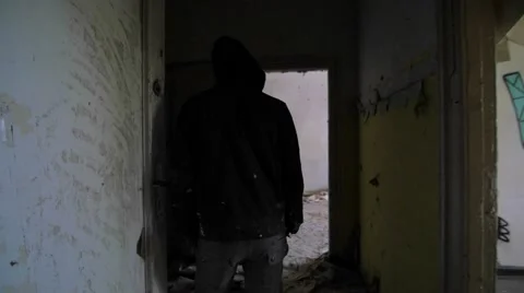 Slow motion of a drunken bum walking in an abandoned house Video stock 58613155