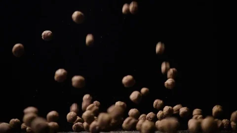 Slow motion dry breakfast cereals, chocolate balls fall down Video stock 73228538