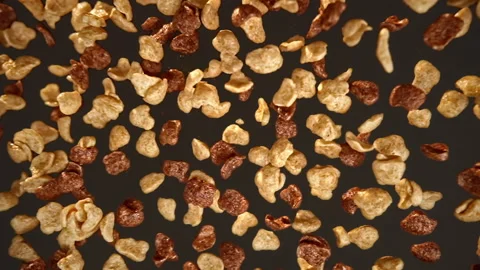 Slow motion dry breakfast with chocolate flying on a black background Stock Footage 148681140