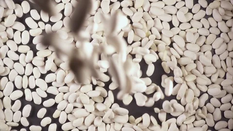 Slow motion dry ingredient groat falls from under the camera Video stock 90901732