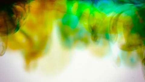 Slow motion, dye and ink being dropped on water and mixing Stock Footage 79371454