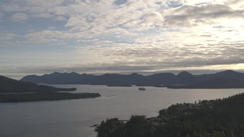 Slow Motion Dynamic Drone Shot Alaskan Lake with Boat and Pine Tree Mountains in Stock Footage 255319199