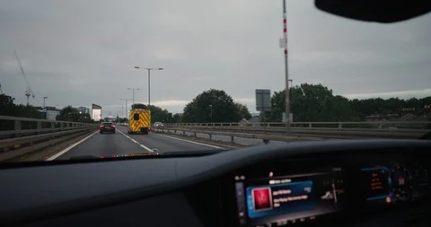 Slow Motion Edit - Driving On The M4 Motorway On A Famous Luxurious Car Stock Footage 115717526