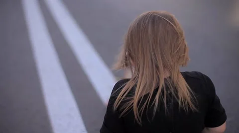 Slow Motion Effect - View From the Back - the Little Girl's Hair Sitting on the Stock Footage 66549279