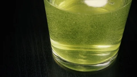 Slow motion effervescent tablet medication in a glass Stock Footage 87756948