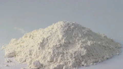 Slow motion of egg falling down into flour Stock Footage 70406297