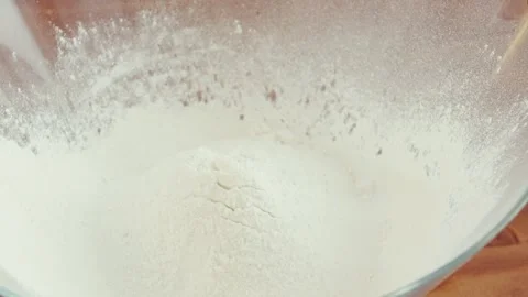 Slow motion egg yolk falls into flour. Family dinner. Italian Cuisine. Homemade Stock Footage 258753154