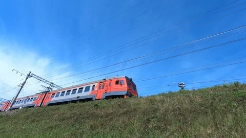 Slow motion of an electric train close-up. Electric train of red color. Stock Footage 93833374