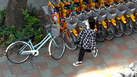 Slow motion elevated of woman wearing protective mask Coronavirus COVID-19. -Dan Stock Footage 125500102