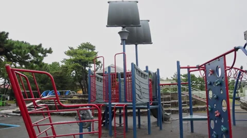 Slow motion empty playground on a rainy day in Japan Video stock 348584055