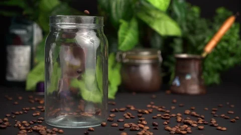 Slow motion Empty transparent jar filled with coffee beans and close the lid of Stock Footage 114030562