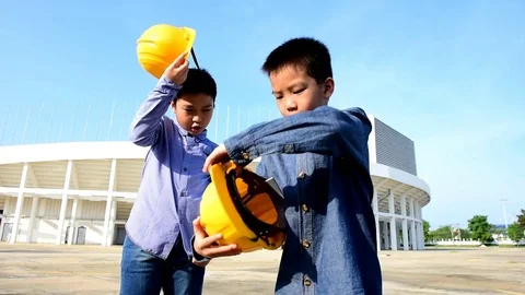 Slow motion Engineer boy wearing yellow safety helmet. Stock Footage 78719106