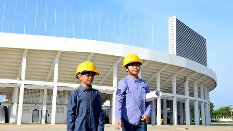 Slow motion Engineer boy with yellow safety helmet Stock Footage 75819351