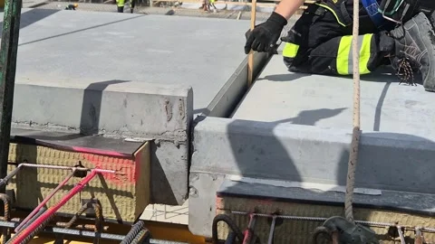 Slow Motion Engineer Guiding Precast Concrete Placement Stock Footage 338226978