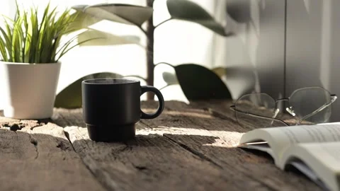 Slow motion espresso and hot coffee mug on rustic table cozy home environment Stock Footage 296997853