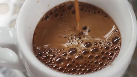 Slow motion of espresso brewing with professional coffee machine from above Stock Footage 73353659
