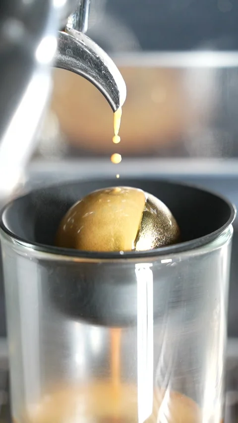 Slow Motion Espresso Coffee Completes Brewing on Cold Paragon Sphere in Close Up Stock Footage 313542920