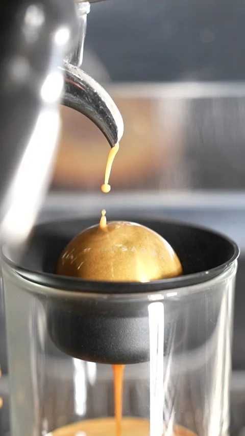 Slow Motion Espresso Coffee Completes Brewing on Cold Paragon Sphere in Close Up Stock Footage 313543075