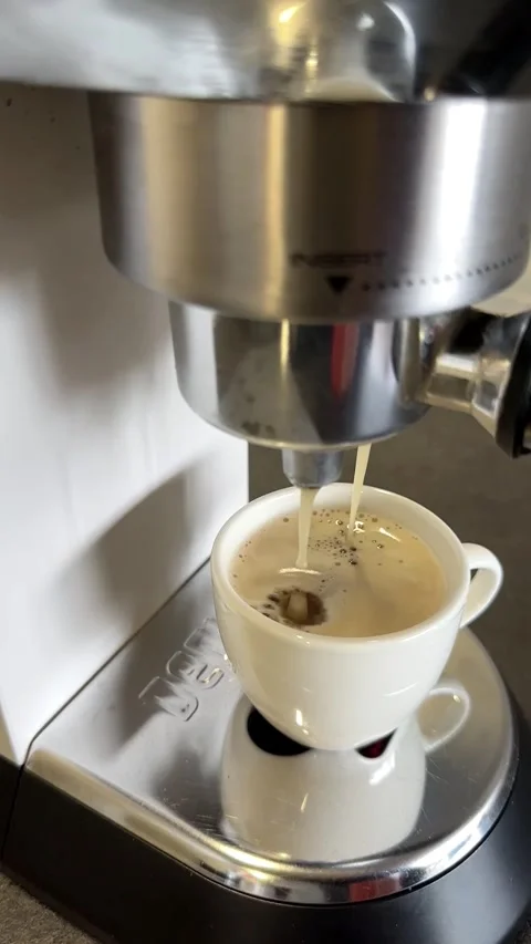 Slow Motion Espresso Extraction with Crema in a White Cup Stock Footage 340138262