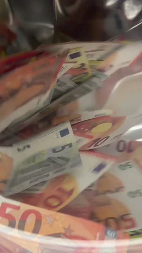 Slow motion of Euro banknotes inside spinning washing machine drum Stock Footage 340141499