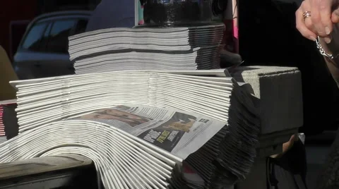 Slow Motion Evening Newspaper Pickup Hot News on the Fly Stock Footage 67883341