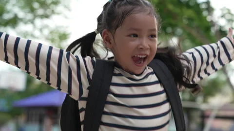 Slow motion of Excited student running into her mother's open arms after school  Stock Footage 338134146