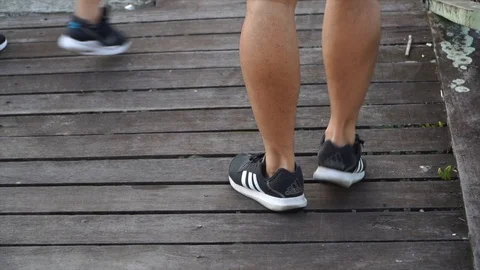 Slow motion - exercises show close up legs Stock Footage 124823675