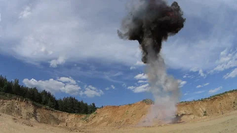 Slow motion explosion. Fiery explosion with a rising cloud of smoke. Stock Footage 90699705