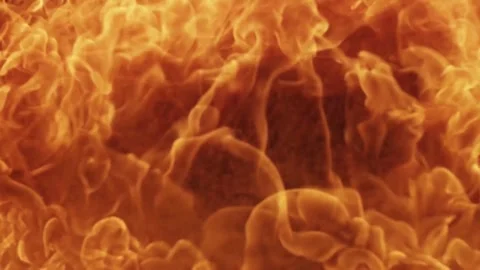 Slow motion explosion of a massive orange fireball bursting Stock Footage 329676195
