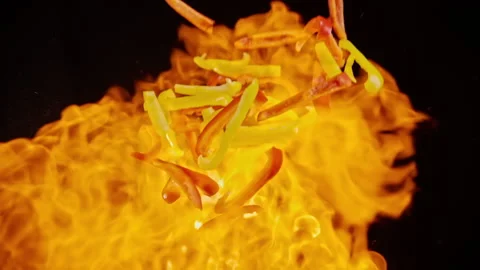 Slow motion explosion of pepper flying in flames Stock Footage 148180258