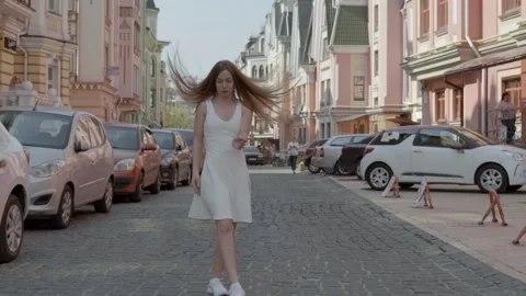 Slow motion. extra long shot. Plastic girl in a white dress dancing classical Stock Footage 135447739