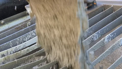 Slow Motion Extreme Close Up of Concrete Pouring into Pump Stock Footage 335710028