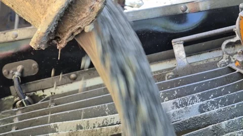 Slow Motion Extreme Close Up of Concrete Pouring into Pump Stock-Footage 341731127