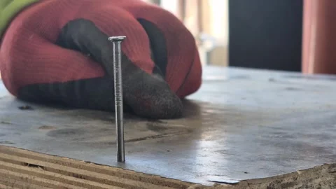 Slow Motion Extreme Close-up of Hammer Hitting a Nail Stock Footage 332506489