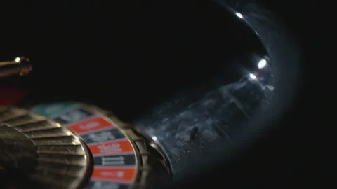 Slow motion extreme close-up spinning number with ball Vidéo 335700148