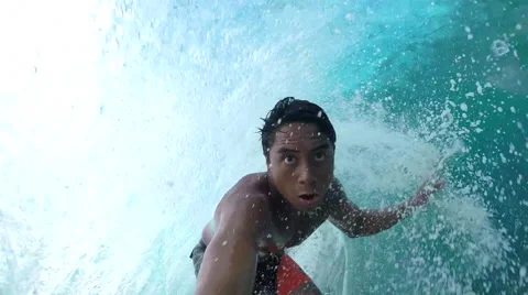 SLOW MOTION: Extreme pro surfer surfing big tube barrel wave Stock Footage 61220684